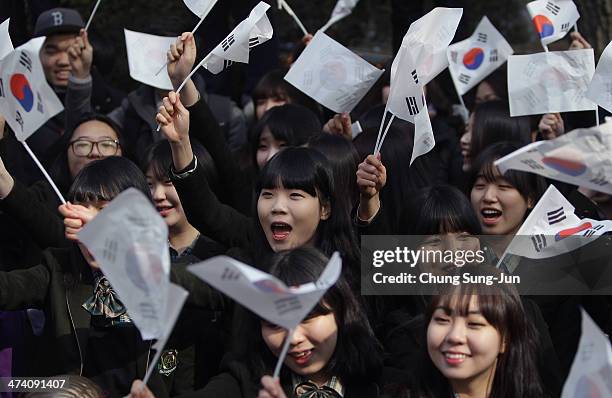 South Korean students wave national flags during an anti-Japan rally in front of the Japanese embassy on February 22, 2014 in Seoul, South Korea....