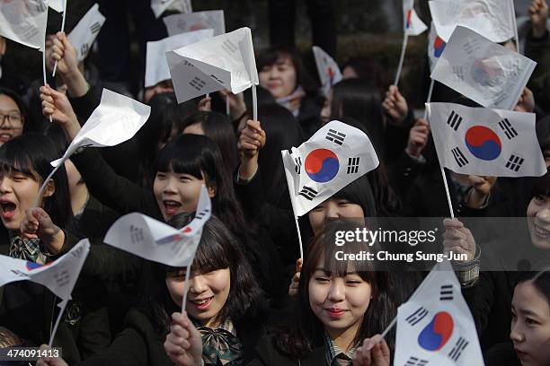 South Korean students wave national flags during an anti-Japan rally in front of the Japanese embassy on February 22, 2014 in Seoul, South Korea....