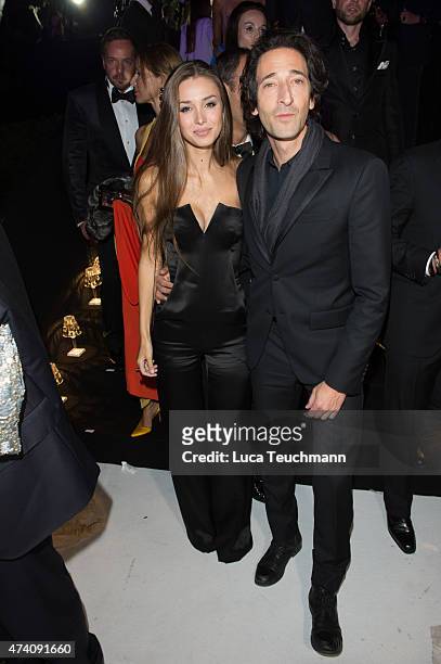 Lara Leito and Adrien Brody attend the De Grisogono Party at the 67th Annual Cannes Film Festival on May 19, 2015 in Cap d'Antibes, France.
