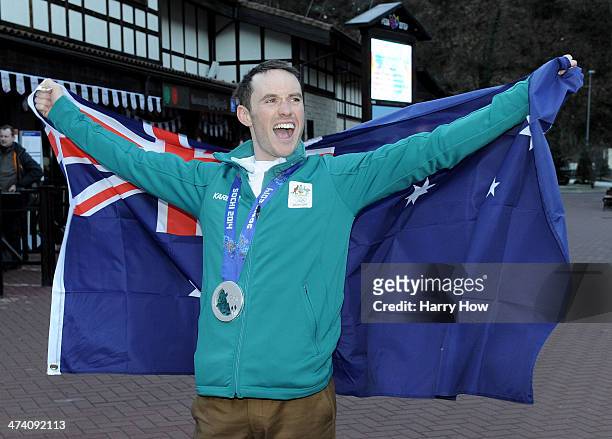 David Morris of Australia poses for photos with his silver medal and Australian flag at the Rosa Khutur Village on February 22, 2014 in Sochi,...