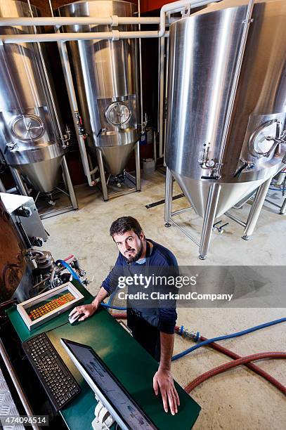 brewmaster at work - mash tun stock pictures, royalty-free photos & images