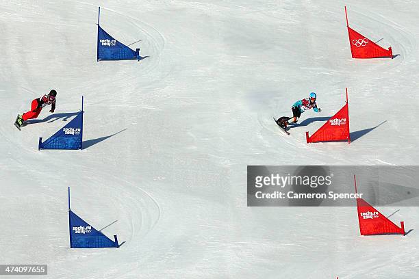 Patrizia Kummer of Switzerland and Selina Joerg of Germany compete in the Snowboard Ladies' Parallel Slalom Qualification on day 15 of the 2014...
