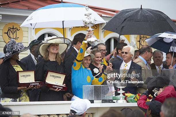 140th Preakness Stakes: Victor Espinoza, jockey for American Pharoah, victorious with Woodlawn Vase trophy in Winner's Circle after winning race at...