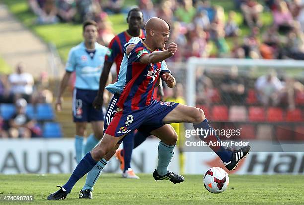 Ruben Zadkovich of the Jets contests the ball against Sydney FC defence during the round 20 A-League match between Newcastle Jets v Sydney FC at...