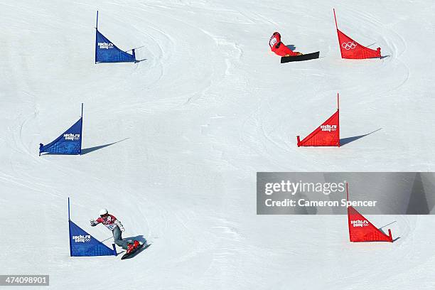 Rok Flander of Slovenia and Philipp Schoch of Switzerland compete in the Snowboard Men's Parallel Slalom Qualification on day 15 of the 2014 Winter...