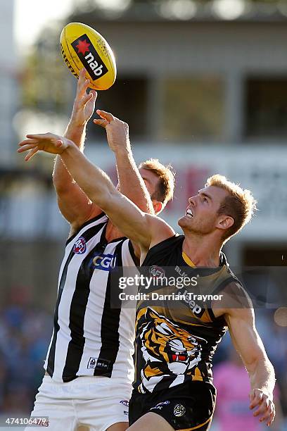 Travis Cloke of Collingwood marks the ball in front of David Astbury of Richmond during the NAB challenge match between the Collingwood Magpies and...