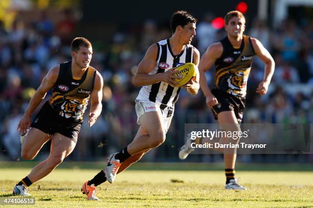 Scott Pendelbury of Collingwood runs with the ball during the NAB challenge match between the Collingwood Magpies and the Richmond Tigers on February...