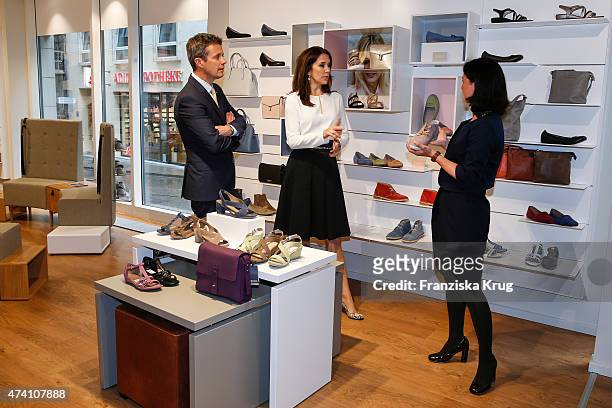Crown Prince Frederik, Crown Princess Mary of Denmark and Nadina Pellegrino during the ECCO store opening on May 20, 2015 in Munich, Germany.