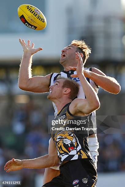 Travis Cloke of Collingwood marks the ball in front of David Astbury of Richmond during the NAB challenge match between the Collingwood Magpies and...