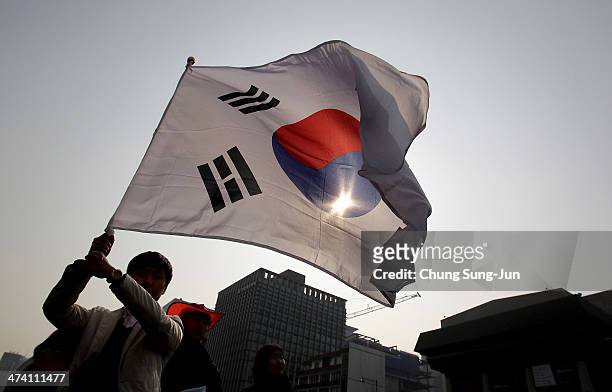 South Korean student waves a national flag during an anti-Japan rally on February 22, 2014 in Seoul, South Korea. South Korea and Japan are making...