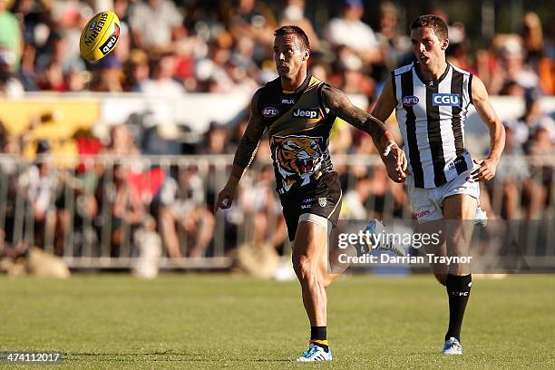 Jake King of Richmond and Clinton Young of Collingwood chase the ball during the NAB challenge match between the Collingwood Magpies and the Richmond...