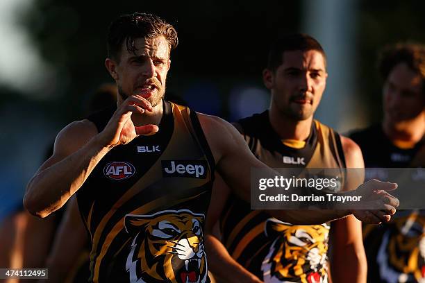 Brett Deledio of Richmond calls for water after the NAB challenge match between the Collingwood Magpies and the Richmond Tigers on February 22, 2014...