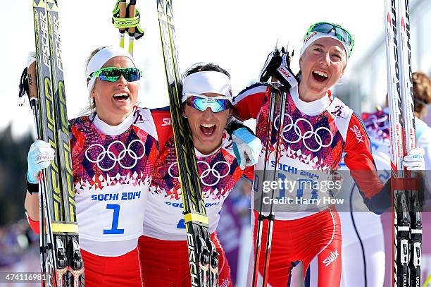 Silver medalist Therese Johaug of Norway, gold medalist Marit Bjoergen of Norway and bronze medalist Kristin Stoermer Steira of Norway celebrate...