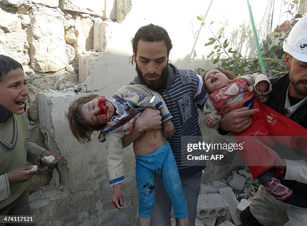 CONTENTSyrian men carry wounded children following an air strike attack by government forces on the northern Syrian city of Aleppo on February 22,...
