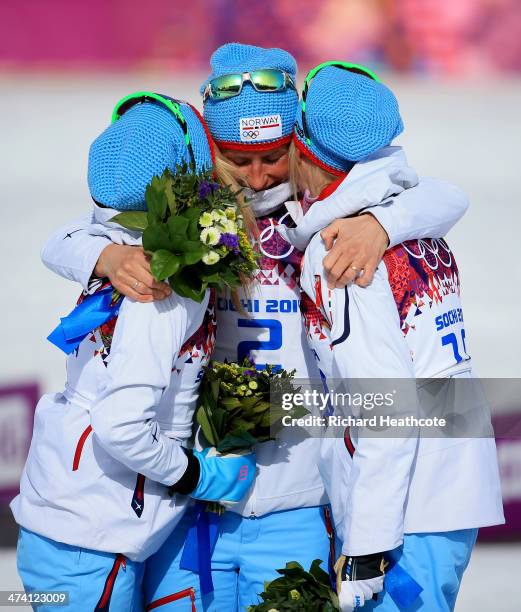 Silver medalist Therese Johaug of Norway, gold medalist Marit Bjoergen of Norway and bronze medalist Kristin Stoermer Steira of Norway celebrate...
