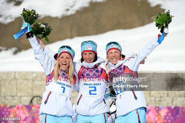 Silver medalist Therese Johaug of Norway, gold medalist Marit Bjoergen of Norway and bronze medalist Kristin Stoermer Steira of Norway celebrate...