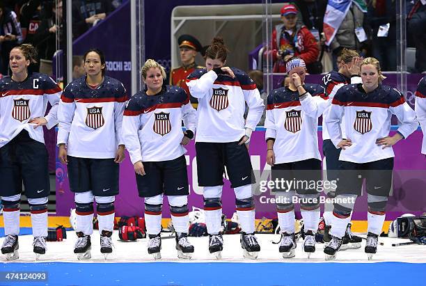 Meghan Duggan, Julie Chu, Brianna Decker, Anne Schleper, Kelli Stack and Jocelyne Lamoureux of the United States react during the flower ceremony...