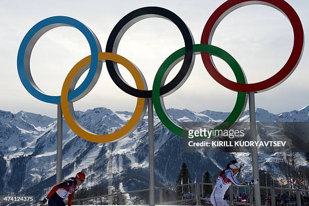 Sweden's Charlotte Kalla and Russia's Yulia Tchekaleva compete in the Women's Cross-Country Skiing 30km Mass Start Free at the Laura Cross-Country...