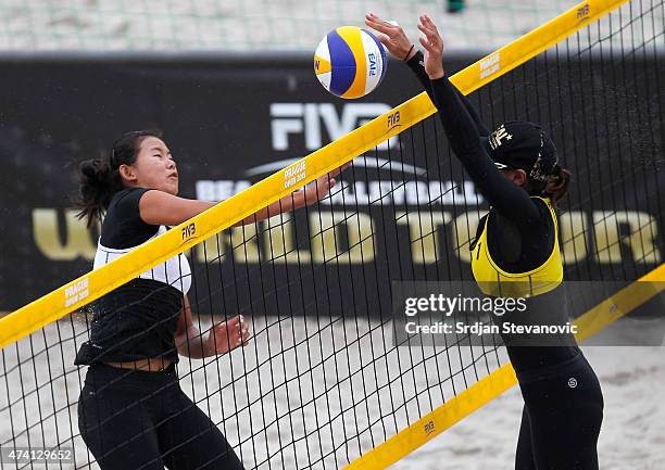 Ningya Tang of China blocks Shinako Tanaka of Japan during the qualifiaction match between Shinako Tanaka and Ayumi Kusano of Japan against Ningya...