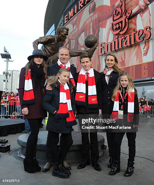 Arsenal legend Dennis Bergkamp and his family at the unveiling of a statue in his honour before the Barclays Premier League match between Arsenal and...