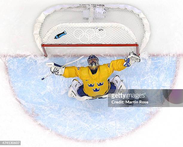 Henrik Lundqvist of Sweden celebrates after defeating Finland 2-1 during the Men's Ice Hockey Semifinal Playoff on Day 14 of the 2014 Sochi Winter...