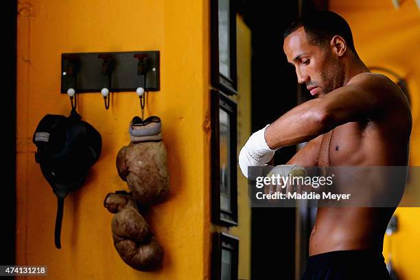 James DeGale wraps his hands during a workout in preparation for his super middleweight fight against Andre Dirrell at The Ring Boxing Club on May...