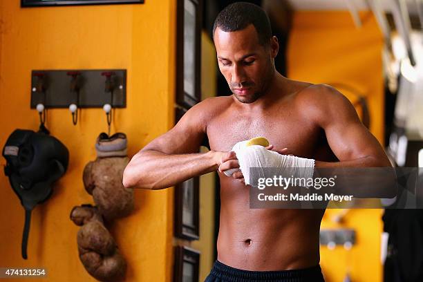 James DeGale wraps his hands during a workout in preparation for his super middleweight fight against Andre Dirrell at The Ring Boxing Club on May...