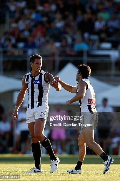 Jesse White and Alex Fasolo of Collingwood celebrate a goal during the NAB challenge match between the Collingwood Magpies and the Richmond Tigers on...