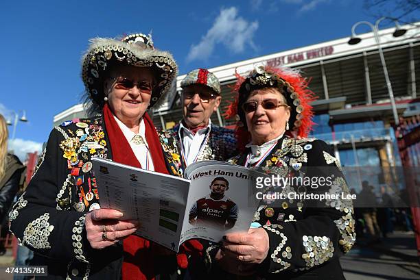 Pearly Kings and Queens read the match day programme during the Barclays Premier League match between West Ham United and Southampton at Boleyn...