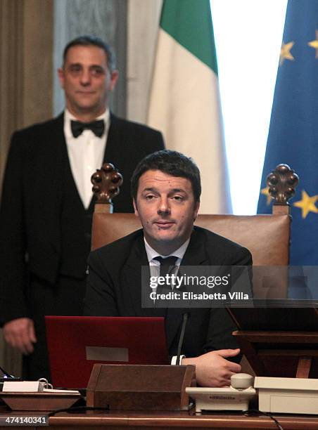 Italy's new Prime Minister Matteo Renzi rings the bell to open his first cabinet meeting on February 22, 2014 in Rome, Italy. Newly designated...