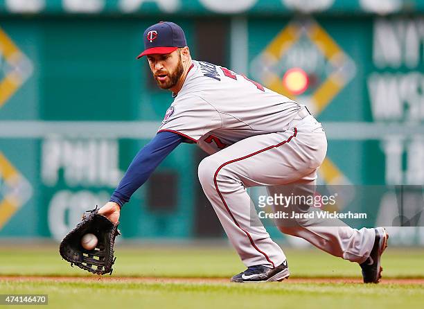 Joe Mauer of the Minnesota Twins reaches for a ground ball hit in the second inning against the Pittsburgh Pirates during the game at PNC Park on May...
