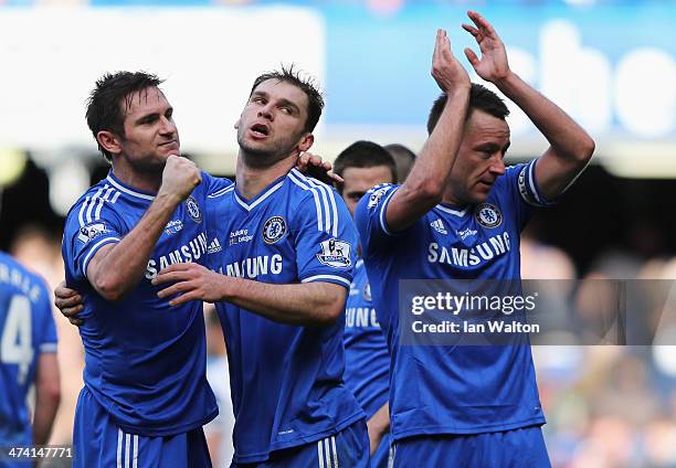 Frank Lampard, Branislav Ivanovic and John Terry of Chelsea celebrate victory after the Barclays Premier League match between Chelsea and Everton at...