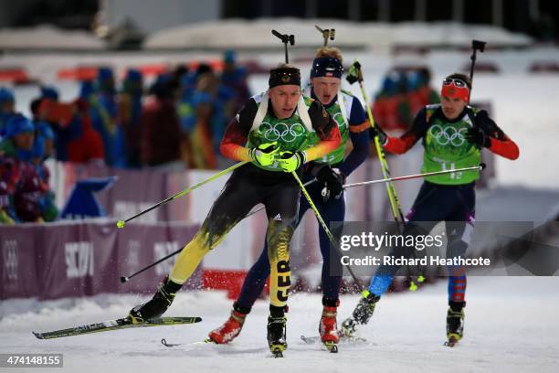 Daniel Boehm of Germany leads Johannes Thingnes Boe of Norway and Evgeny Ustyugov of Russia into the shooting range during the Men's 4 x 7.5 km Relay...