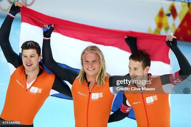 Sven Kramer, Koen Verweij and Jan Blokhuijsen of the Netherland celebrate winning the gold medal during the Men's Team Pursuit Final A Speed Skating...