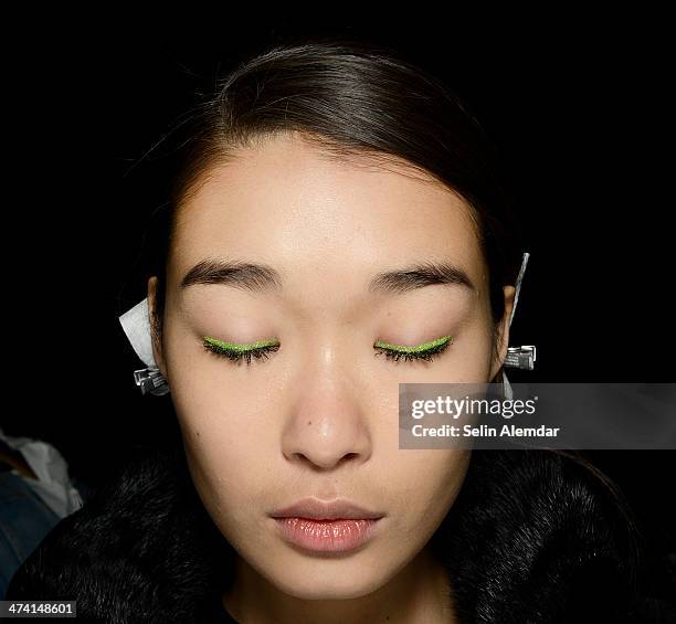 Model poses backstage ahead of Au Jour Le Jour show during Milan Fashion Week Womenswear Autumn/Winter 2014 on February 22, 2014 in Milan, Italy.