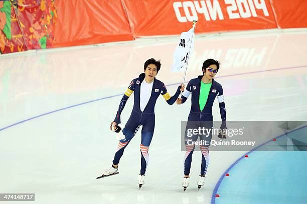 Seung Hoon Lee and Hyong Jun Joo of South Korea celebrate winning the silver medal during the Men's Team Pursuit Final A Speed Skating event on day...