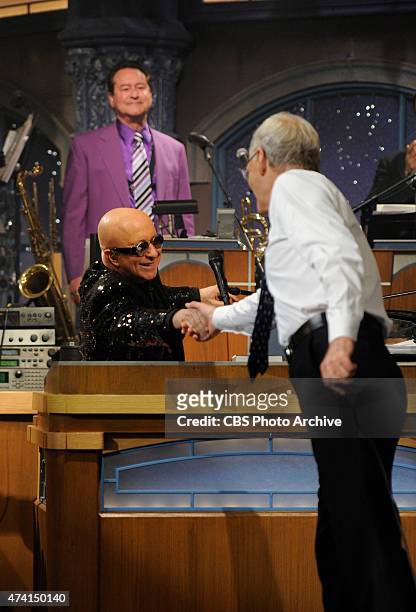 David Letterman shakes hands with Paul Shaffer after the final taping of the Late Show with David Letterman, Wednesday May 20, 2015 on the CBS...