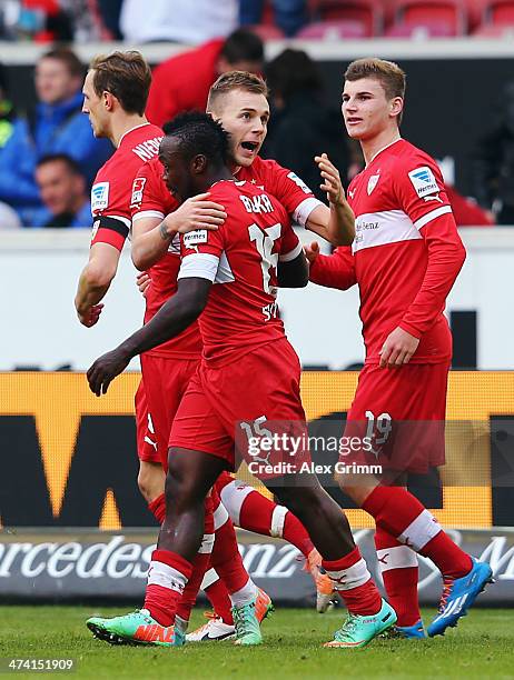 Arthur Boka of Stuttgart celebrates his team's first goal with team mats Alexandru Maxim and Timo Werner during the Bundesliga match between VfB...