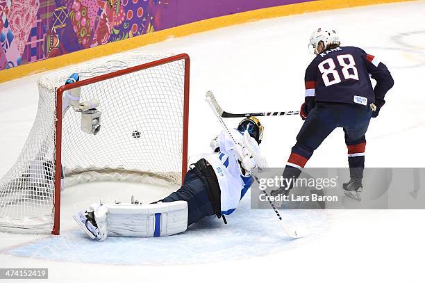 Tuukka Rask of Finland saves a penalty shot by Patrick Kane of the United States in the first period during the Men's Ice Hockey Bronze Medal Game on...