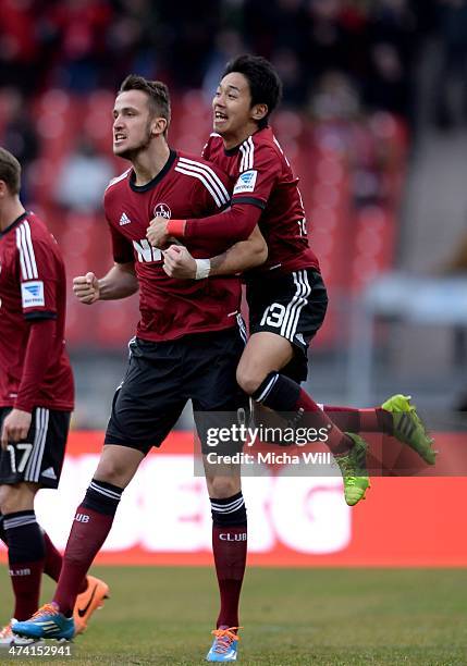 Tomas Pekhart of Nuernberg celebrates after scoring his team's second goal and is hugged by Hiroshi Kiyotake of Nuernberg during the Bundesliga match...