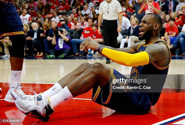 LeBron James of the Cleveland Cavaliers reacts after being called for his third foul in the third quarter against the Atlanta Hawks during Game One...