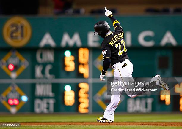Andrew McCutchen of the Pittsburgh Pirates celebrates his game-tying solo home run in the eighth inning against the Minnesota Twins during the game...