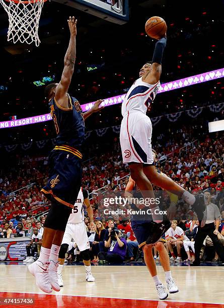 Kent Bazemore of the Atlanta Hawks dunks against Tristan Thompson of the Cleveland Cavaliers in the third quarter during Game One of the Eastern...