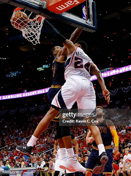 Kent Bazemore of the Atlanta Hawks dunks against Tristan Thompson of the Cleveland Cavaliers in the third quarter during Game One of the Eastern...