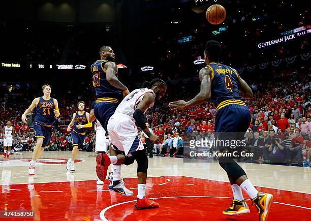 DeMarre Carroll of the Atlanta Hawks injures his left leg in the fourth quarter against the Cleveland Cavaliers during Game One of the Eastern...