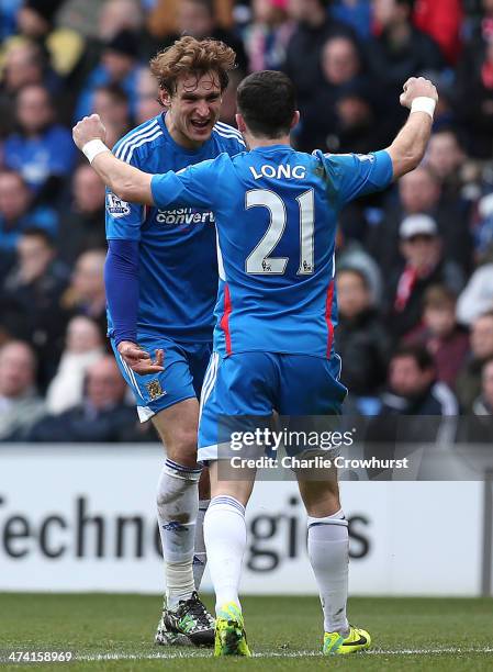 Nikica Jelavic of Hull celebrates with team mate Shane Long after scoring the team's second goal during the Barclays Premier League match between...