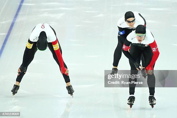 Lucas Makowsky, Denny Morrison and Mathieu Giroux of Canada react after competing during the Men's Team Pursuit Final B Speed Skating event on day...