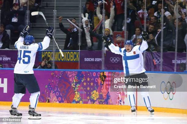 Jussi Jokinen of Finland celebrates his goal in the second period with Sami Vatanen against the United States during the Men's Ice Hockey Bronze...