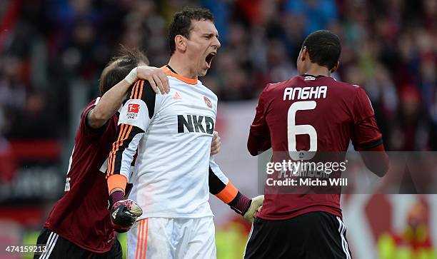 Goalkeeper Raphael Schaefer of Nuernberg cheers after parrying Braunschweigs second penalty during the Bundesliga match between 1. FC Nuernberg and...