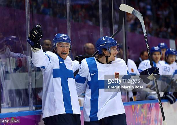 Jussi Jokinen of Finland celebrates his goal in the second period with Sami Vatanen against the United States during the Men's Ice Hockey Bronze...